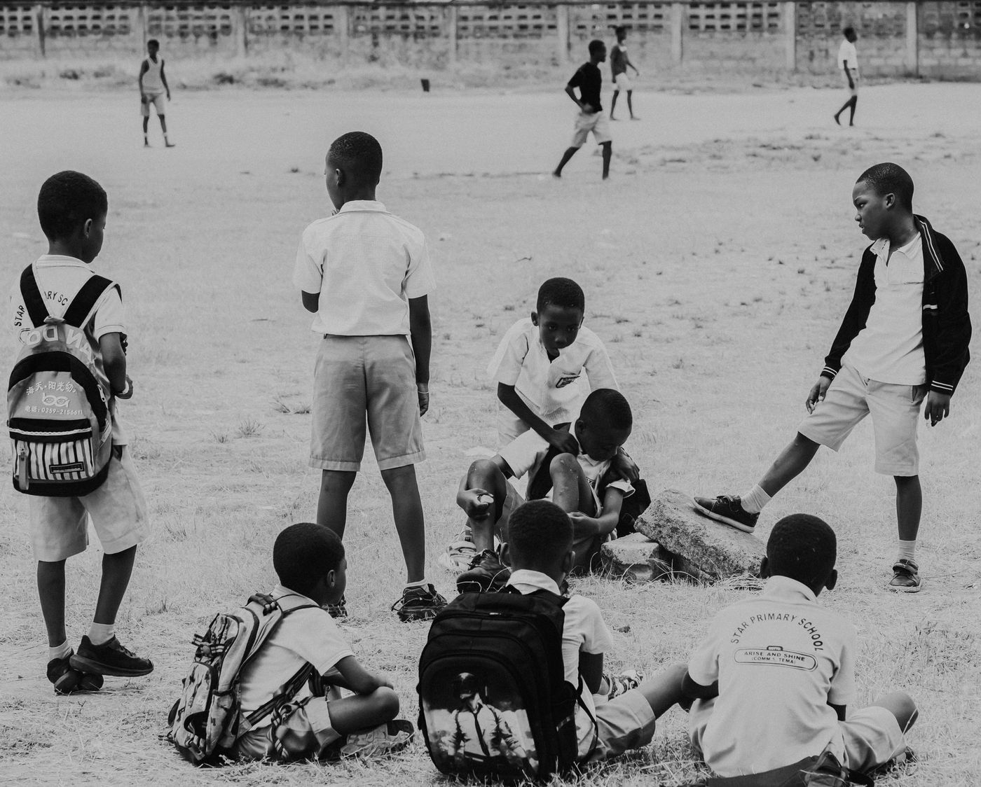 Illustrative pupils playing football on a school field, not the actual school or pupils