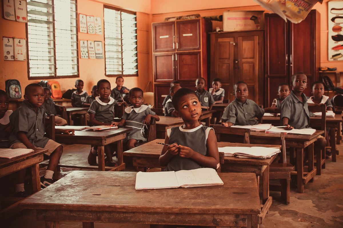 Illustrative primary school pupils seated at their desks during a classroom lesson, not the actual school or pupils